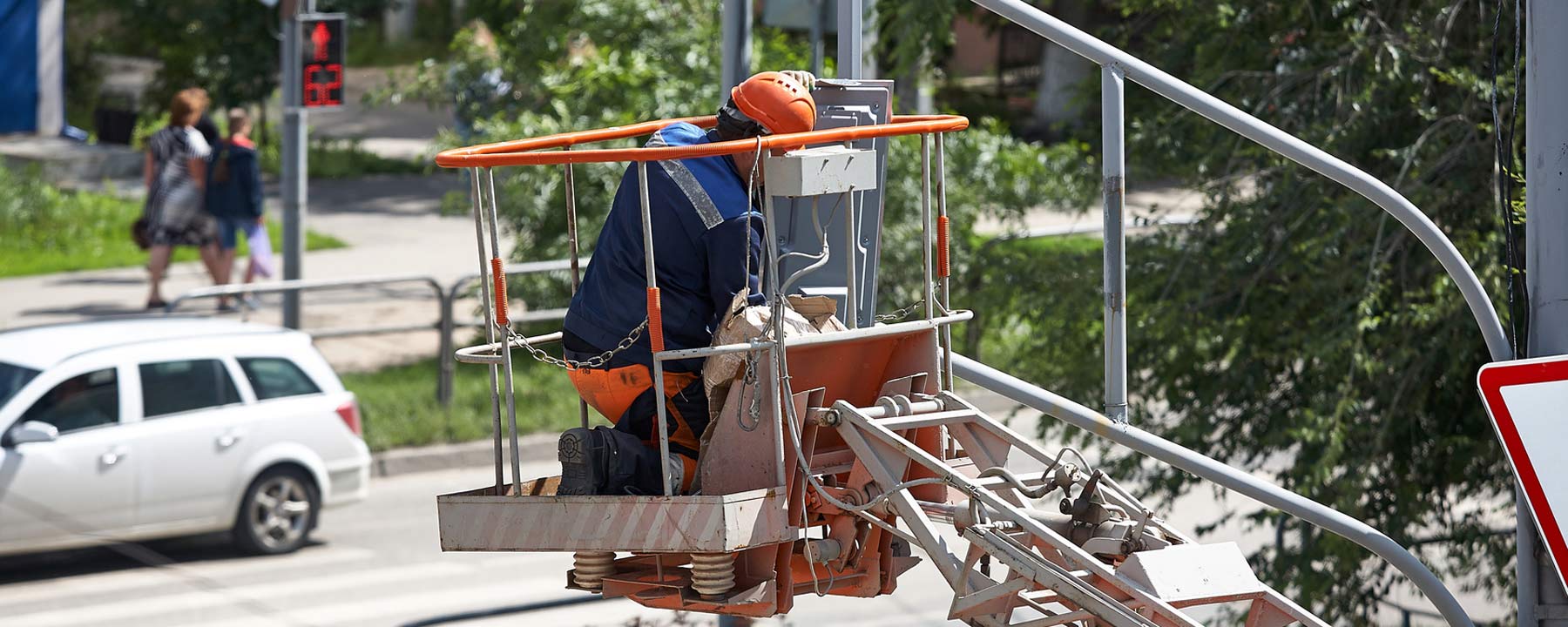 man working in bucket lift